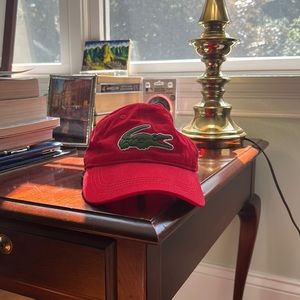 Never worn red Lacoste cap